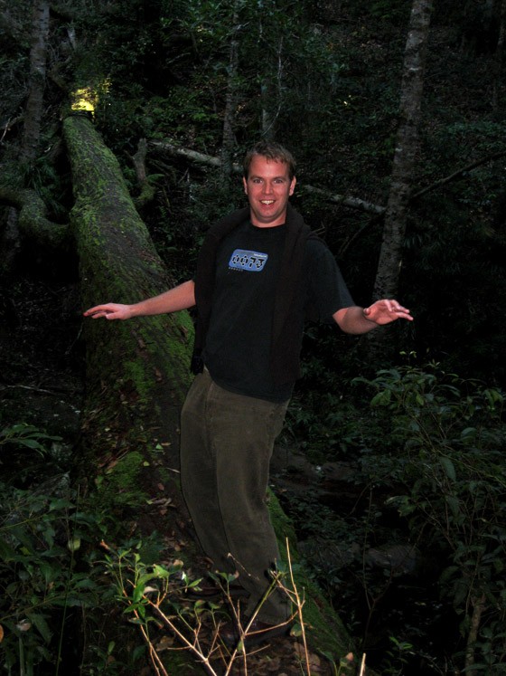 Stu balancing on a fallen tree